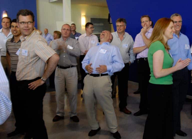 Participants of One Voice, the corporate conference energiser ran by Orangeworks, laughing and dancing together.