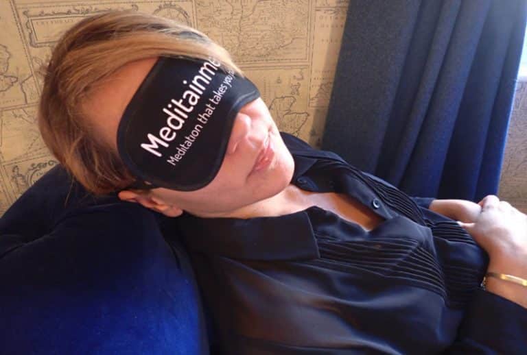 Woman wearing eye mask during Meditainment, an employee wellness programme with Orangeworks