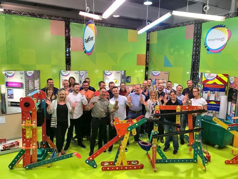 Delegates of Orangeworks team development workshop with the contraption they built as part of an experiential activity called Plan of Action.