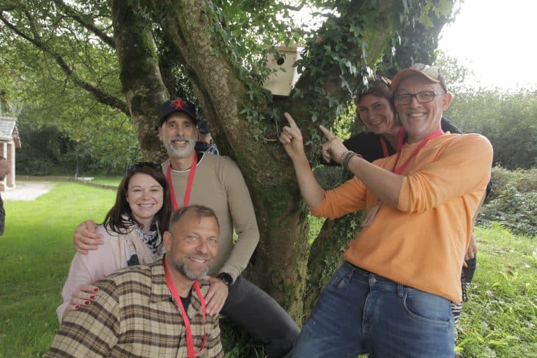 Delegates standing with their bird box that they made during their CSR based team building activity with Orangeworks.