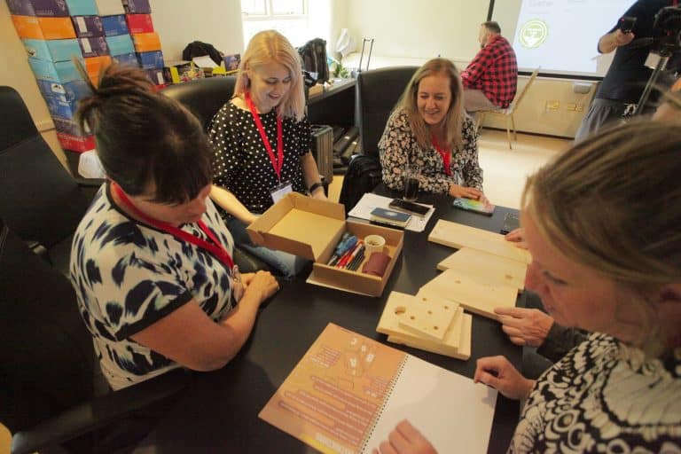 Delegates building a bird box together during their CSR based team building activity, The Green Game, hosted by Orangeworks.