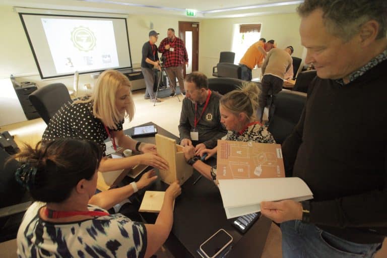 Delegates building a bird box together during their CSR based team building activity, The Green Game, hosted by Orangeworks.