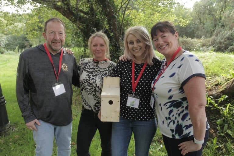 Delegates standing with their bird box that they made during their CSR based team building activity with Orangeworks.
