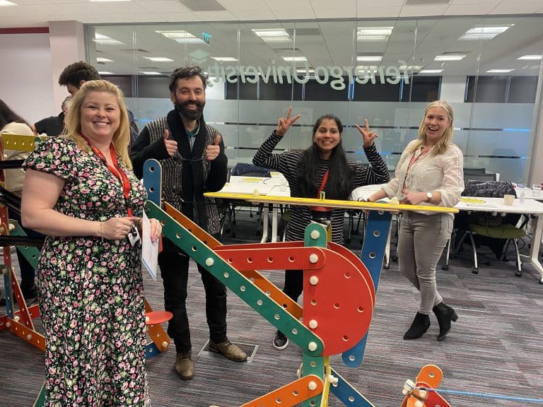 Delegates of Orangeworks team development workshop with the contraption they built as part of an experiential activity called Plan of Action.