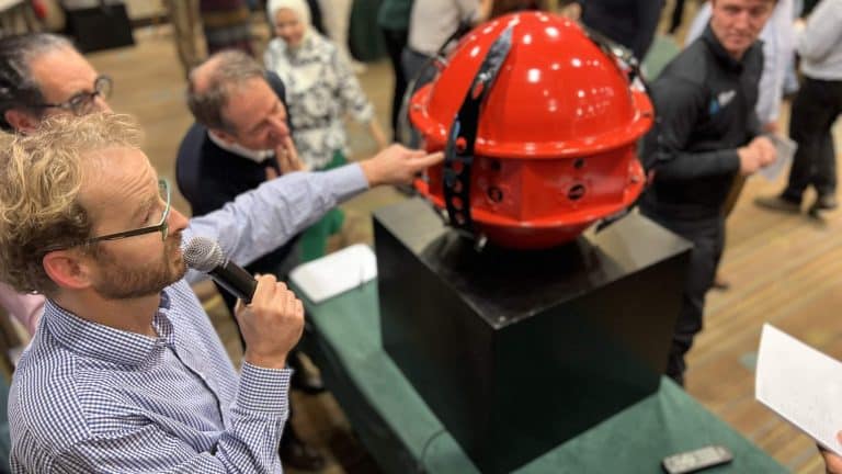 Delegates looking at the big Red Alert ball during their team learning & development workshop with Orangeworks.