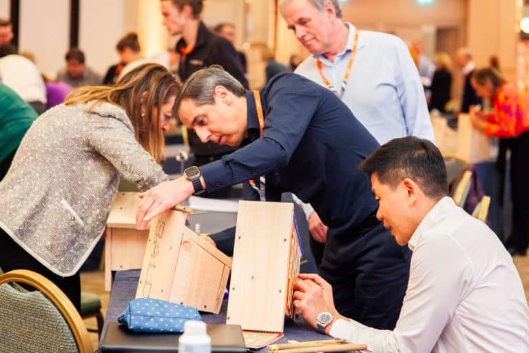 Delegates building a bird box as part of their CSR based Green Game team building challenge with Orangeworks.