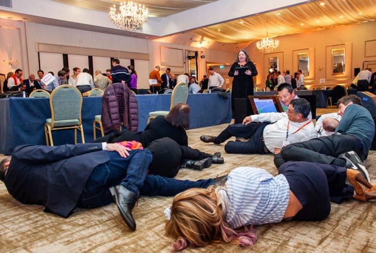 Delegates posing for a photo as part of their Green Game team building challenge with Orangeworks.