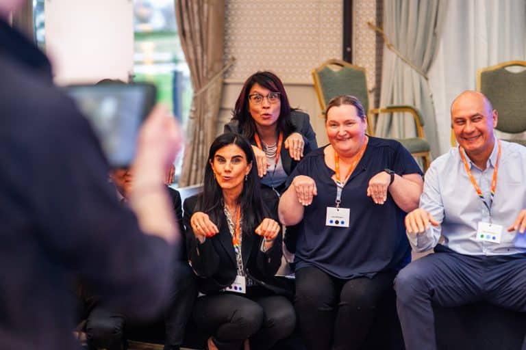 Delegates posing for a photo as part of their Green Game CSR based team building challenge with Orangeworks.