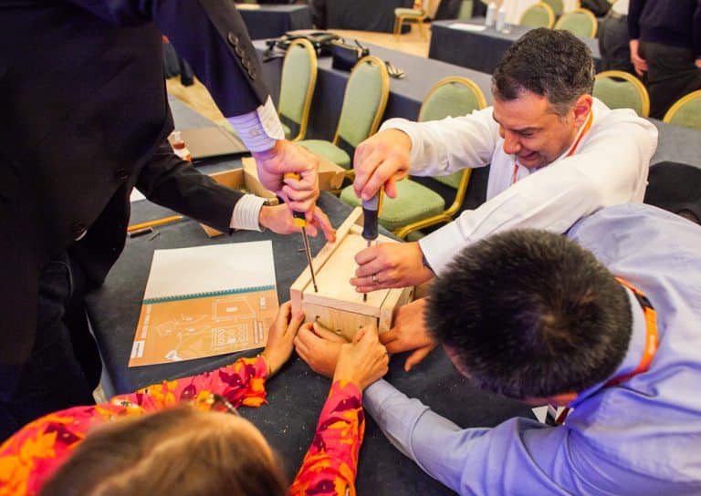 Delegates building a bird box as part of their CSR based Green Game team building challenge with Orangeworks.