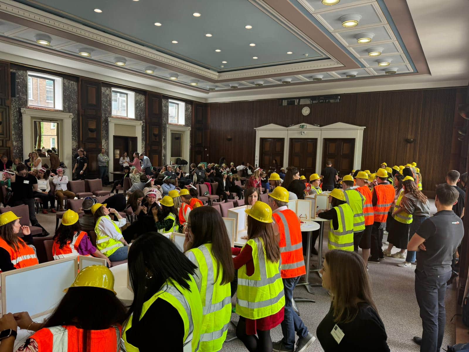 Delegates of London Business School playing iBuild together, one of Orangeworks innovative team building exercises.