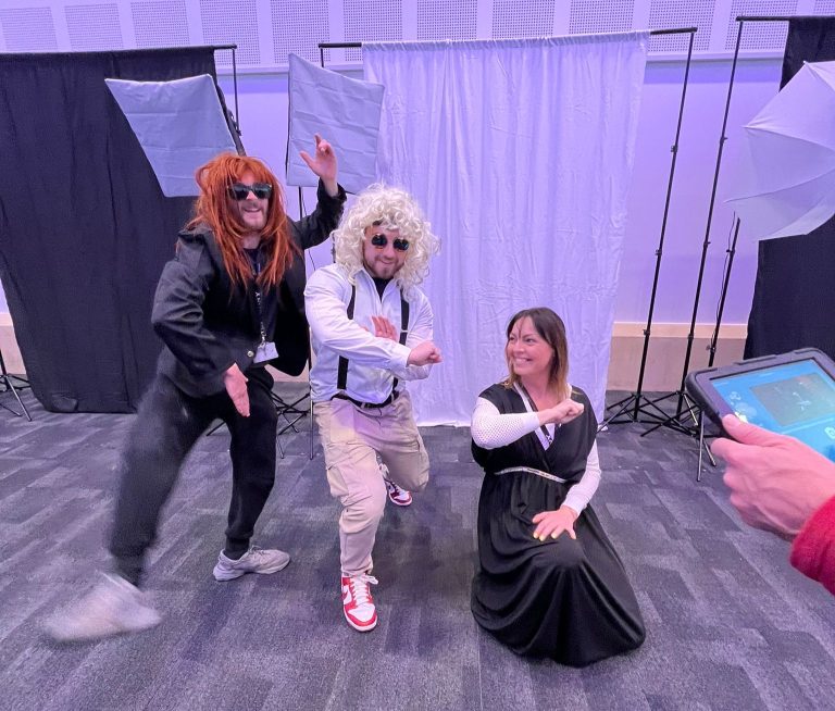 Delegates dressing up in costumes and taking selfies as part of Orangeworks team bonding activity called Picture Perfect.