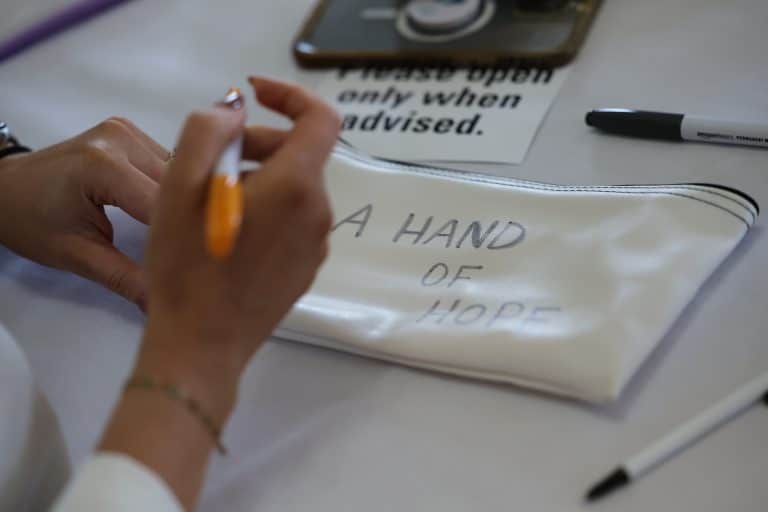 Delegates participating in Give a Hand, a charity team engagement activity by Orangeworks in partnership with Lightbulb.
