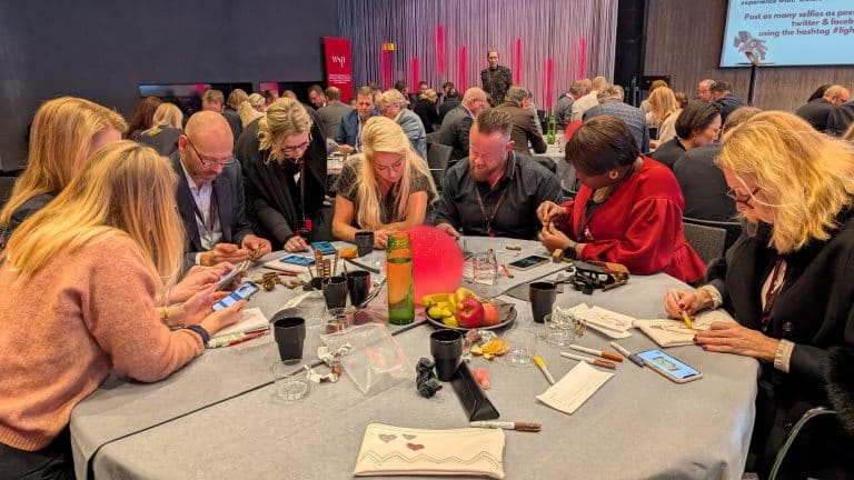 Delegates participating in Give a Hand, a charity team engagement activity by Orangeworks in partnership with Lightbulb.