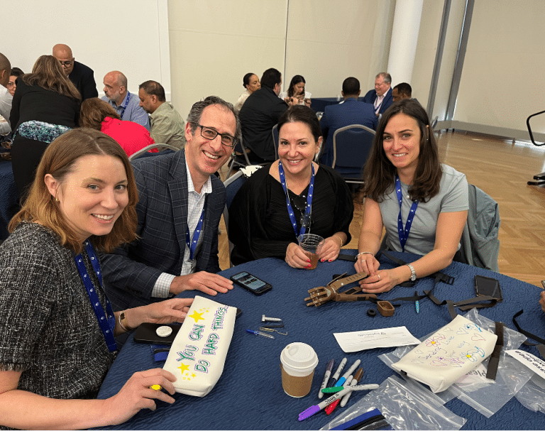 Delegates participating in Give a Hand, a charity team engagement activity by Orangeworks in partnership with Lightbulb.