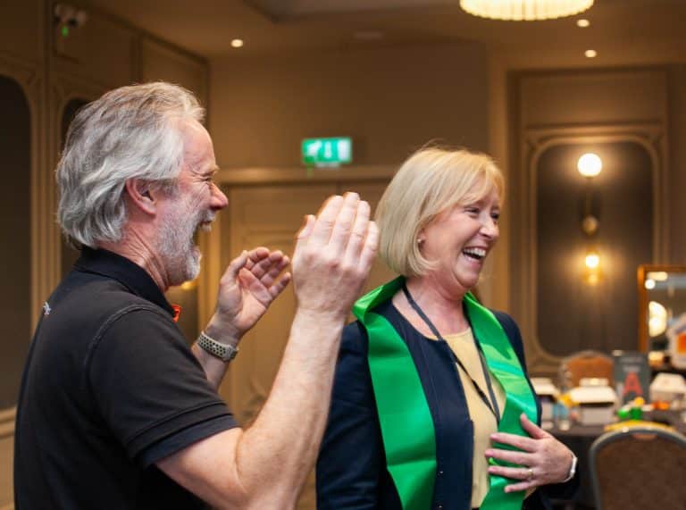 Our Event Manager John laughing with one of the delegates who was deemed a 'foe' during Orangeworks Traitors inspired activity called Friend or Foe.