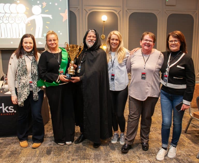 The winning team of Friend or Foe, Orangeworks Traitors inpsired corporate team activity, with their trophy.