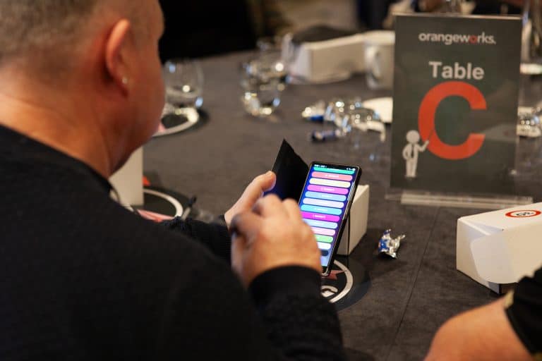 A delegate of Orangeworks team game Friend or Foe voting using our Crowdpurr app.
