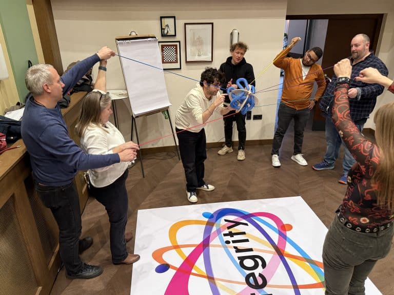 Delegates working together to complete Orangeworks immersive learning and development activity called Integrity.