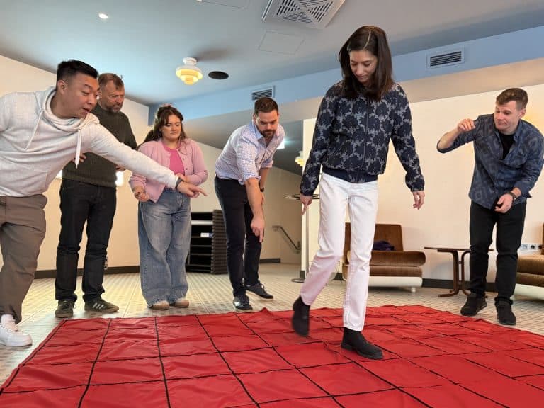 Delegates working together to complete Orangeworks immersive learning and development activity called Integrity.