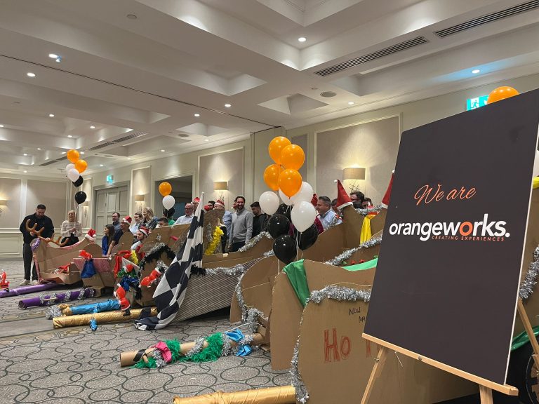 Delegates enjoying Orangeworks Christmas themed team bonding activity called Flat out Sleigh Ride.