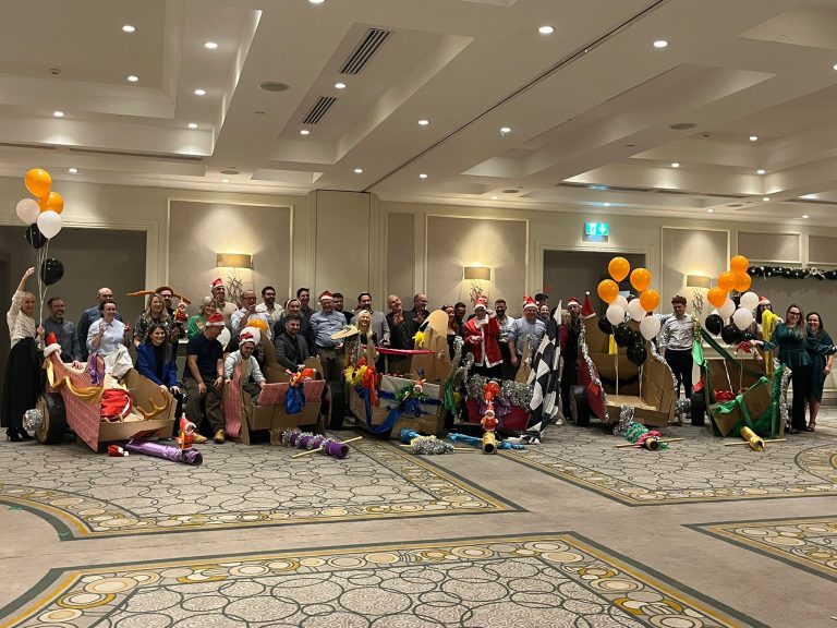 Delegates enjoying Orangeworks Christmas themed team bonding activity called Flat out Sleigh Ride.
