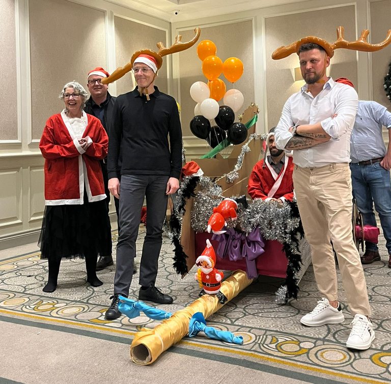 Delegates enjoying Orangeworks Christmas themed team bonding activity called Flat out Sleigh Ride.