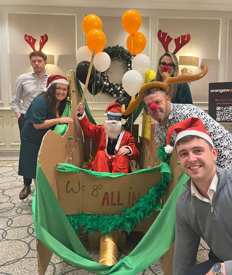 Delegates enjoying Orangeworks Christmas themed team bonding activity called Flat out Sleigh Ride.