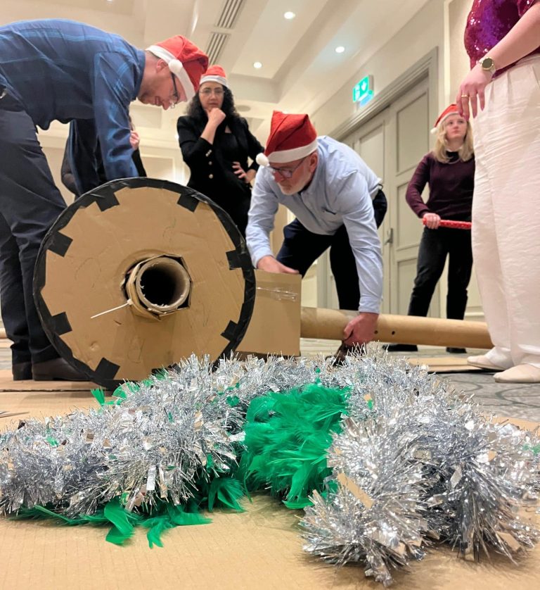 Delegates enjoying Orangeworks Christmas themed team bonding activity called Flat out Sleigh Ride.