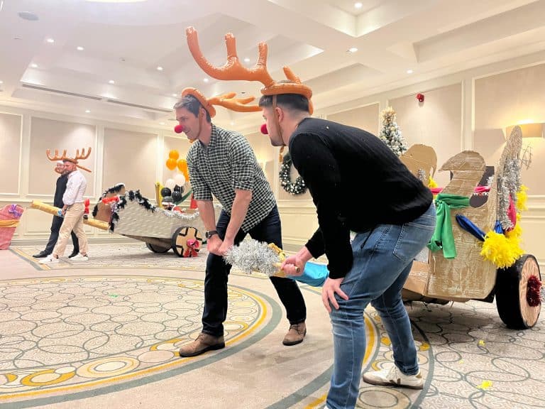 Delegates enjoying Orangeworks Christmas themed team bonding activity called Flat out Sleigh Ride.