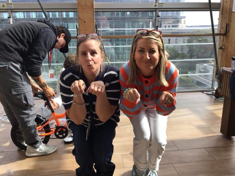 Delegates taking part in Orangeworks csr charity based activity where they build bikes and donate them to local charities.