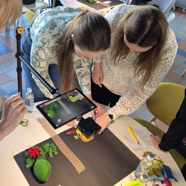 Delegates working together on their stop motion animation as part of their team building workshop provided by Orangeworks.