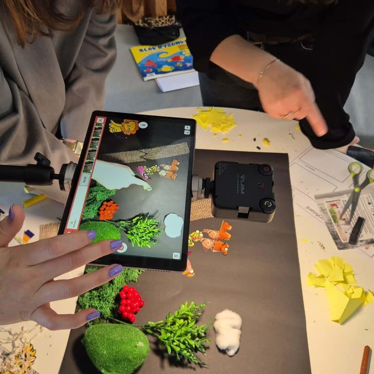 Delegates working together on their stop motion animation as part of their team building workshop provided by Orangeworks.