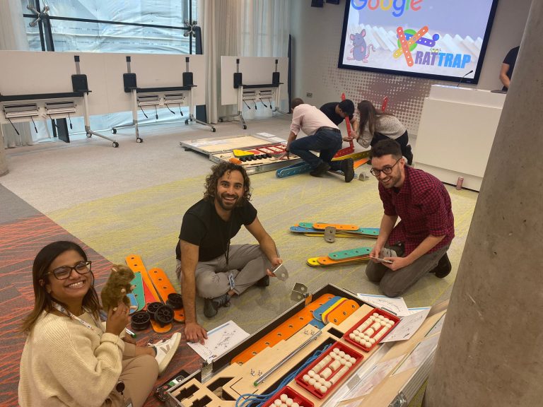 Delegates taking part in Orangeworks team development challenge called Plan of Action - it's all about collaboration and working together.