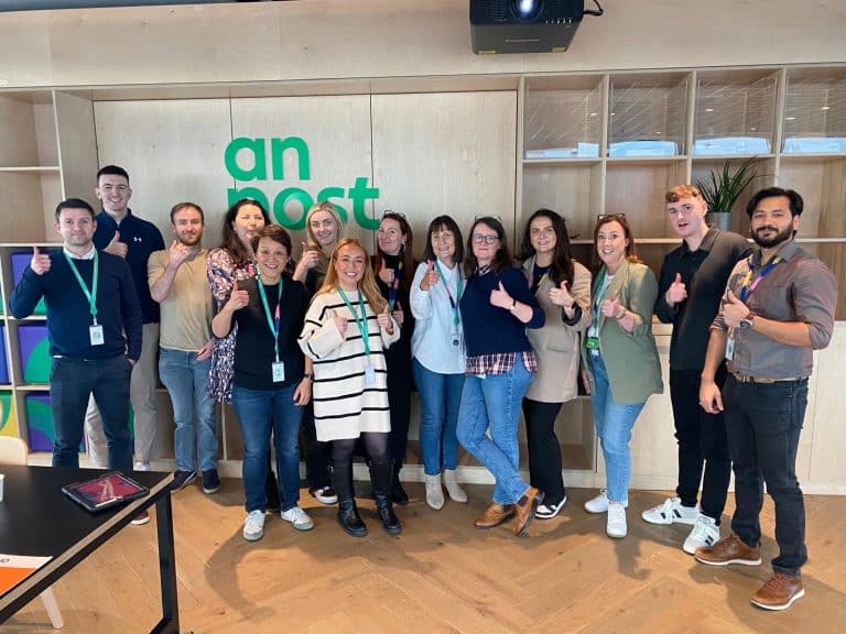 Delegates participating in one of Orangeworks fun team development activities called Drone Control. The aim of the activity is to successfully fly drones through man-made obstacles.