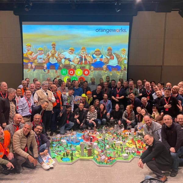 Delegates showcasing their miniature city that they built as part of Orangeworks creative construction based team activity called City Build.