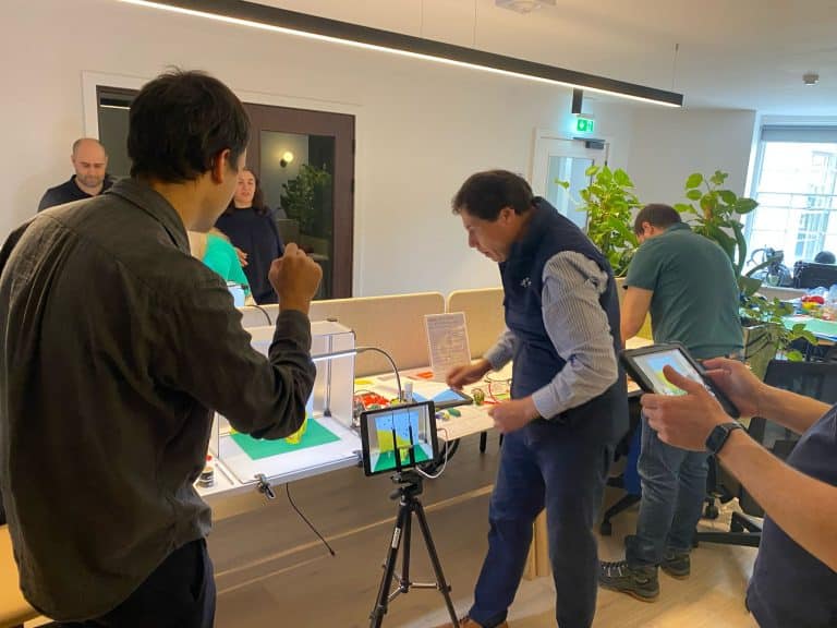 Delegates working together on their stop motion animation as part of their team building workshop provided by Orangeworks.