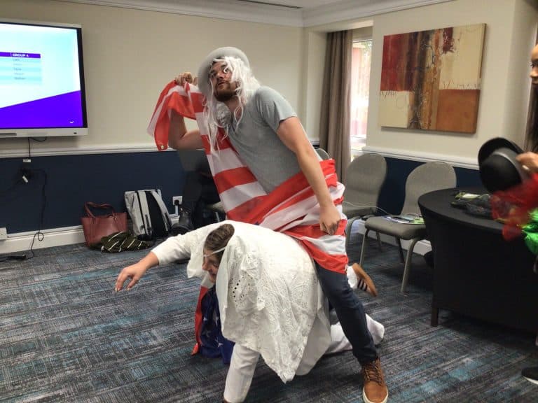 Delegates dressing up in costumes and taking selfies as part of Orangeworks team bonding activity called Picture Perfect.