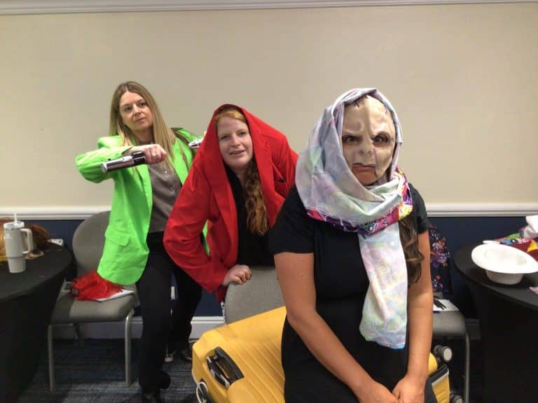 Delegates dressing up in costumes and taking selfies as part of Orangeworks team bonding activity called Picture Perfect.