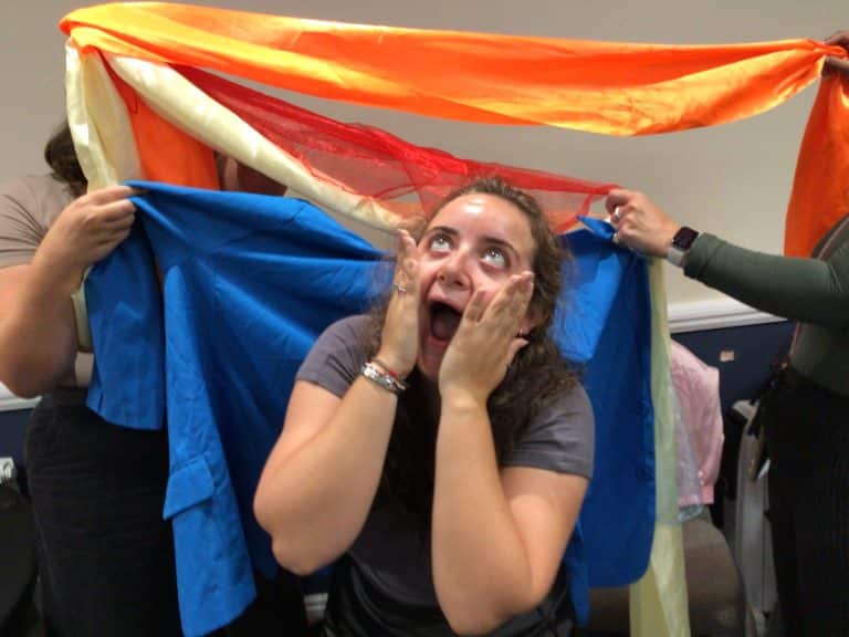 Delegates dressing up in costumes and taking selfies as part of Orangeworks team bonding activity called Picture Perfect.