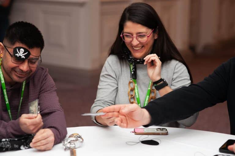 Delegates enjoying Orangeworks team development negotiation game called Trade Winds.