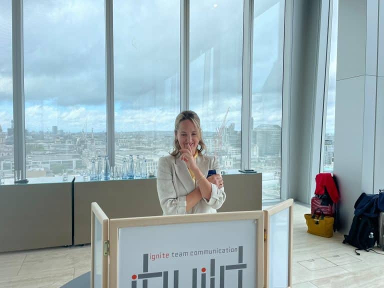 Participant concentrating on an Orangeworks iBuild construction challenge.