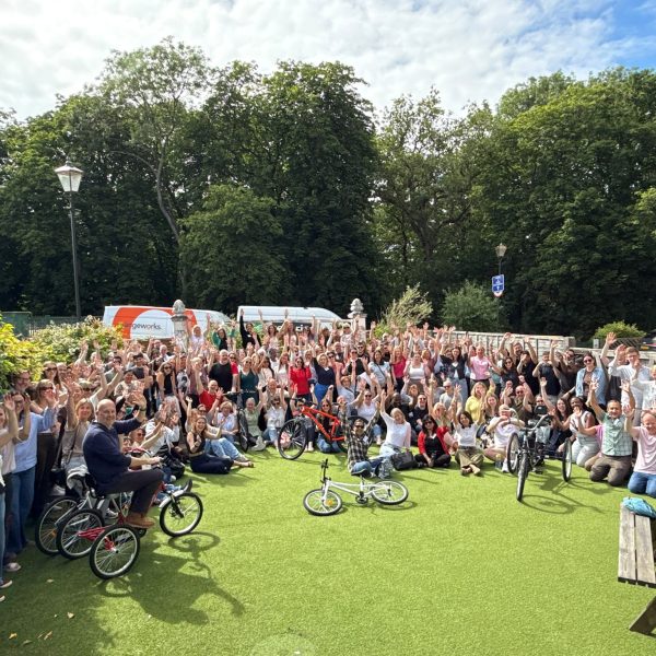170 delegates after building bikes in a charity bike build